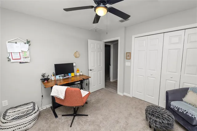 a workspace with furniture and window