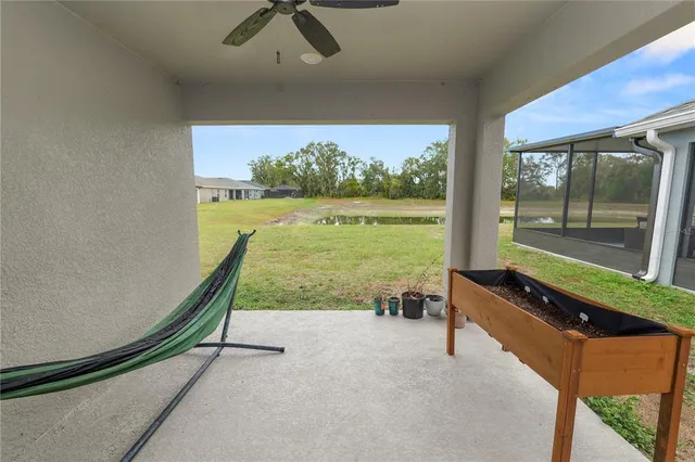 a view of a living room and floor to ceiling window