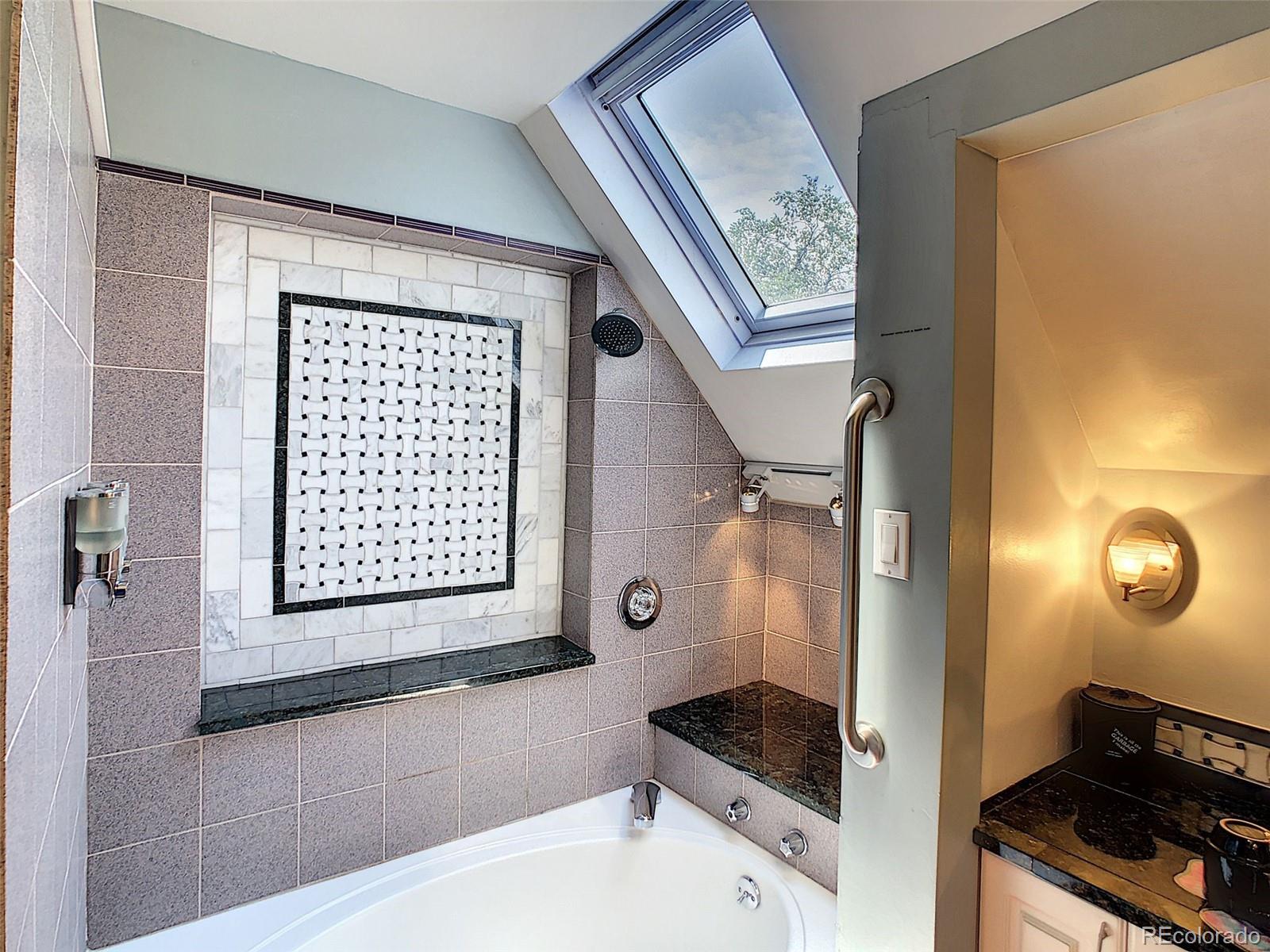 124 South Sherman Street, Unit UPSTAIRS Denver, CO 80209 - Photo 14 of 35 a bathroom with a sink and a mirror