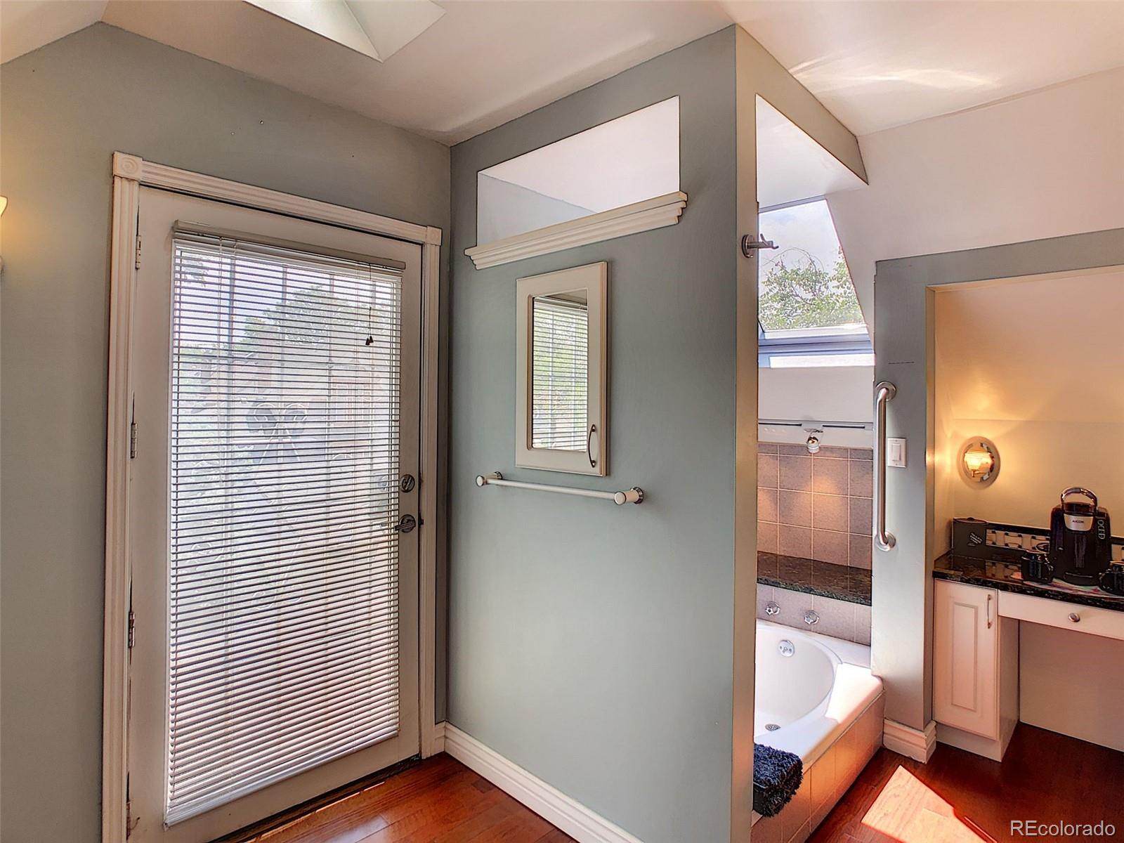 124 South Sherman Street, Unit UPSTAIRS Denver, CO 80209 - Photo 23 of 35 a view of a hallway with wooden floor and a living room