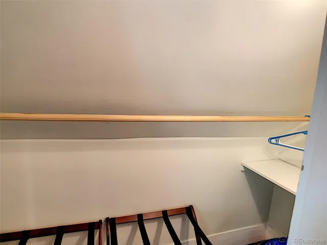 a view of staircase with white walls and windows