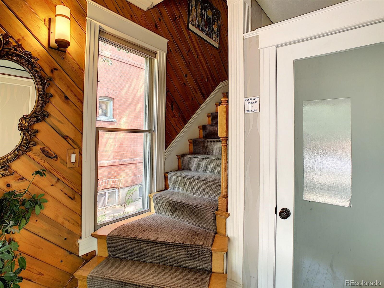 124 South Sherman Street, Unit UPSTAIRS Denver, CO 80209 - Photo 26 of 35 a view of staircase with white walls and windows