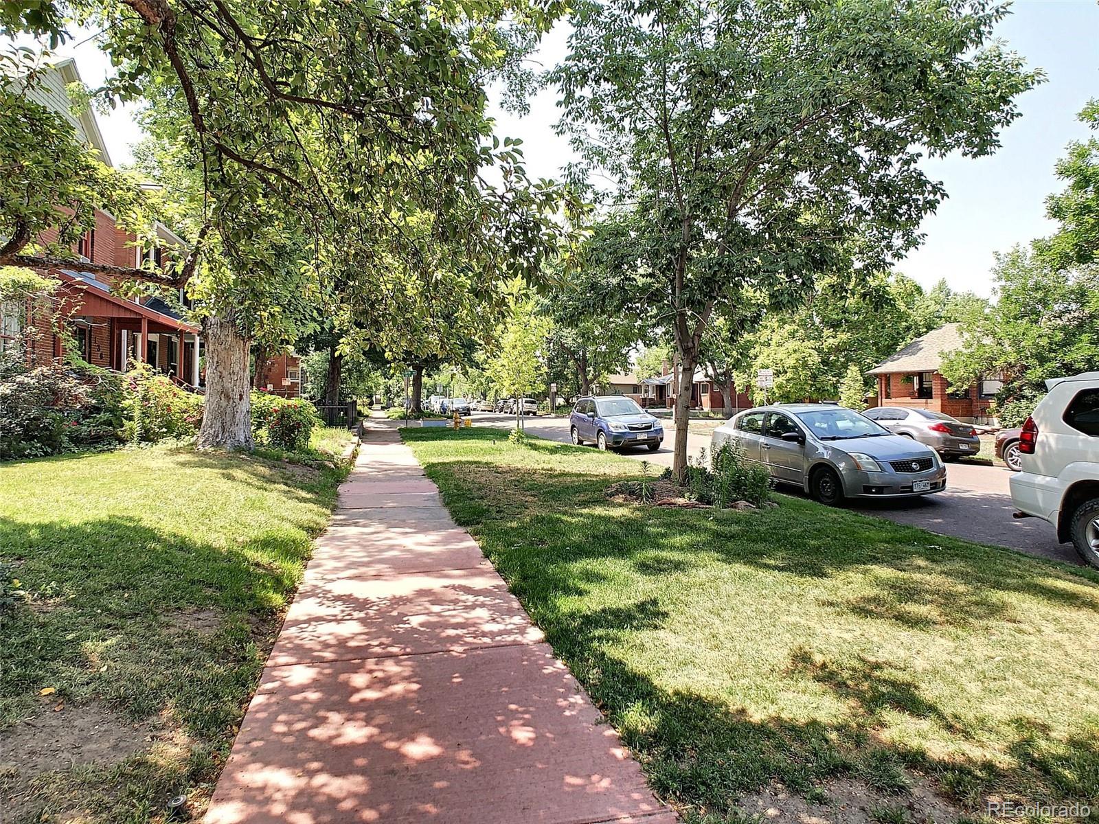 124 South Sherman Street, Unit UPSTAIRS Denver, CO 80209 - Photo 30 of 35 a view of a park with bench and trees