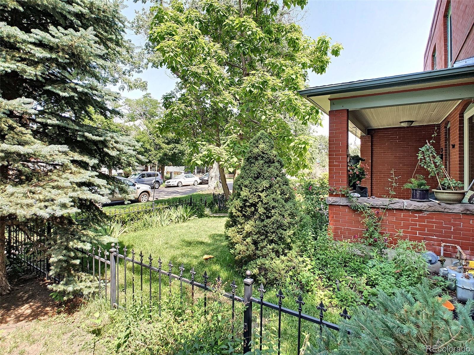 124 South Sherman Street, Unit UPSTAIRS Denver, CO 80209 - Photo 32 of 35 a view of a house with a tree