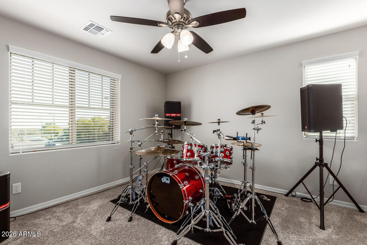 21188 West Almeria Road Buckeye, AZ 85396 - Photo 25 of 43 a view of a room with gym equipment