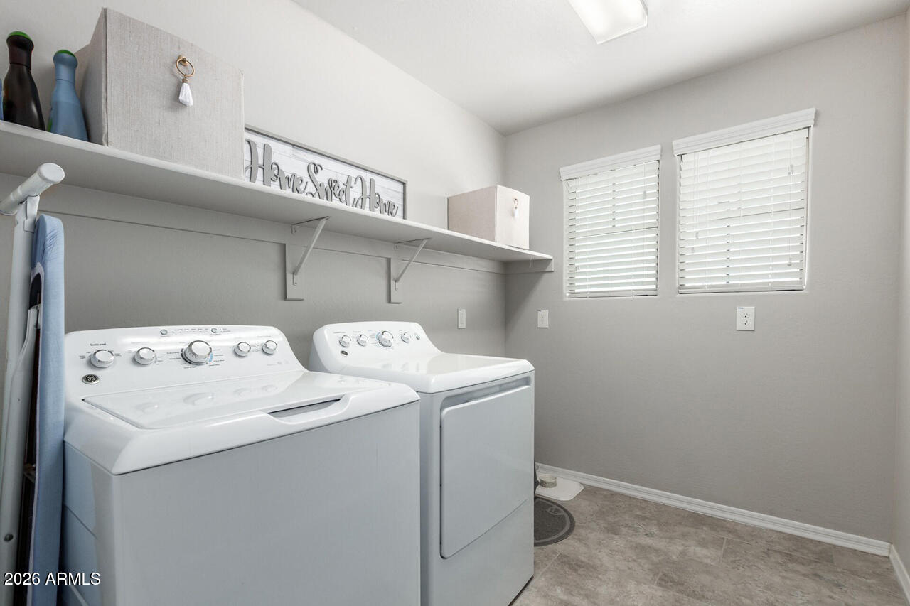 21188 West Almeria Road Buckeye, AZ 85396 - Photo 28 of 43 a utility room with dryer and washer
