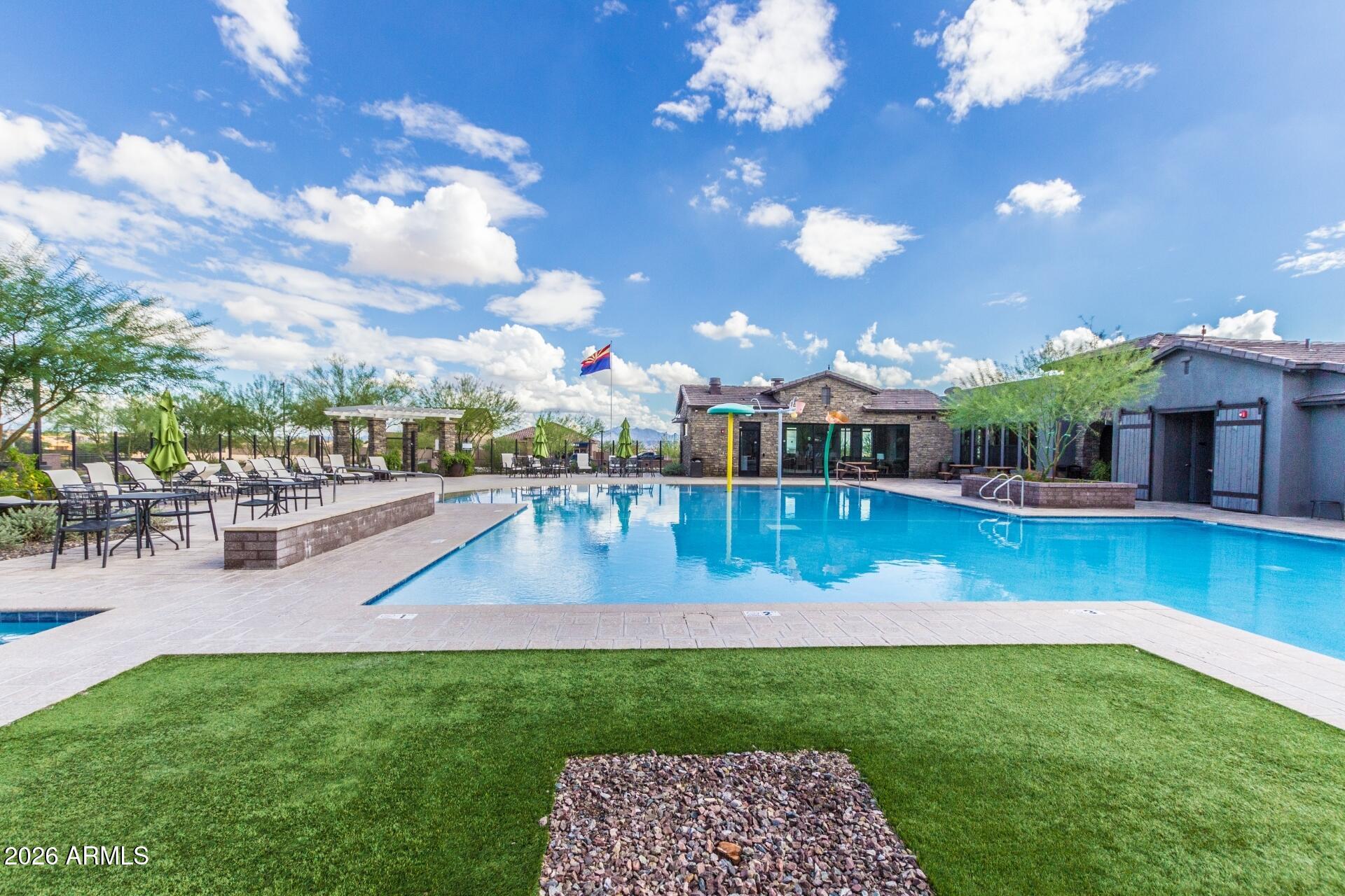 21188 West Almeria Road Buckeye, AZ 85396 - Photo 32 of 43 a view of a house with a swimming pool