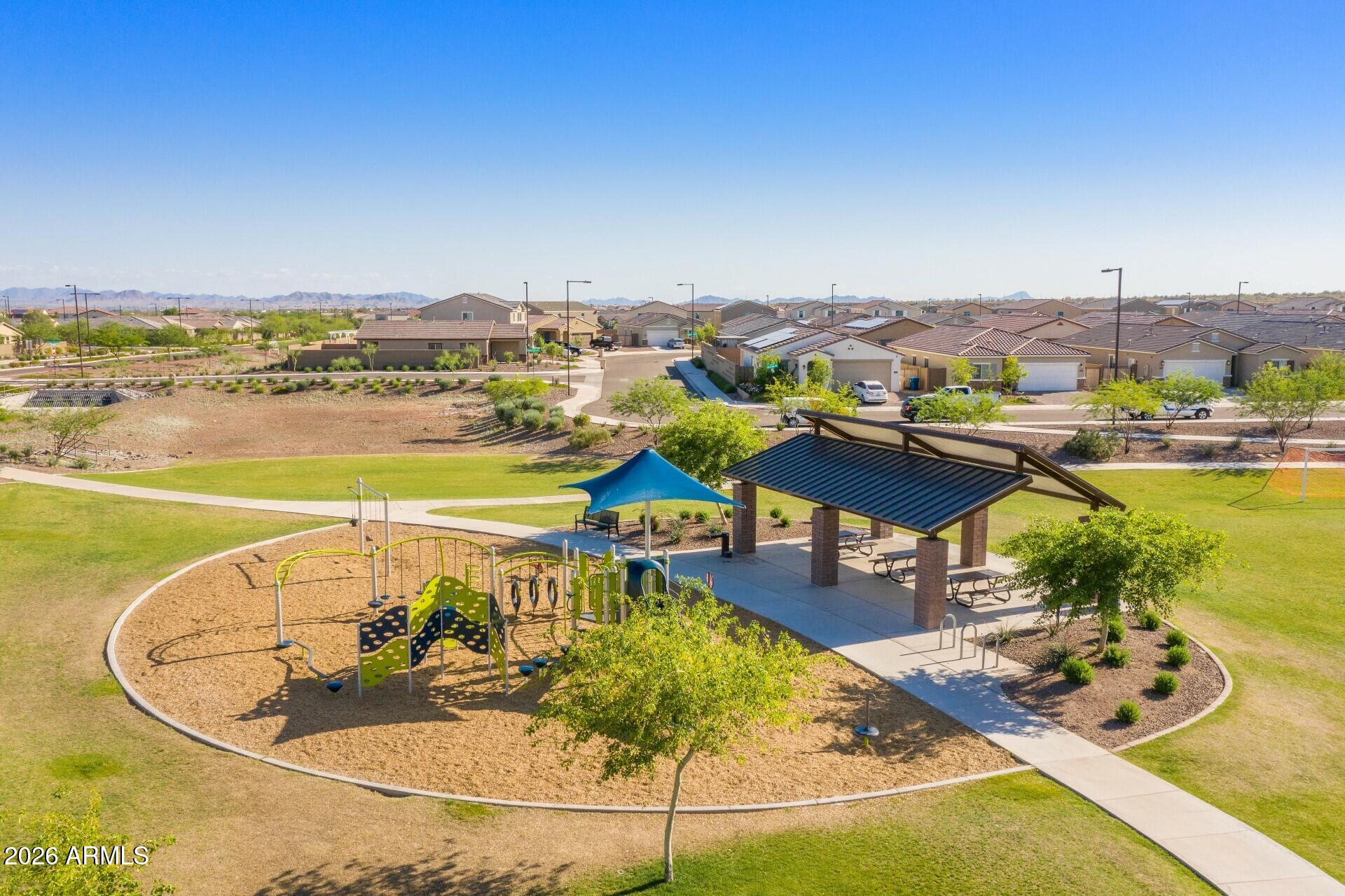 21188 West Almeria Road Buckeye, AZ 85396 - Photo 40 of 43 a view of a swimming pool with furniture