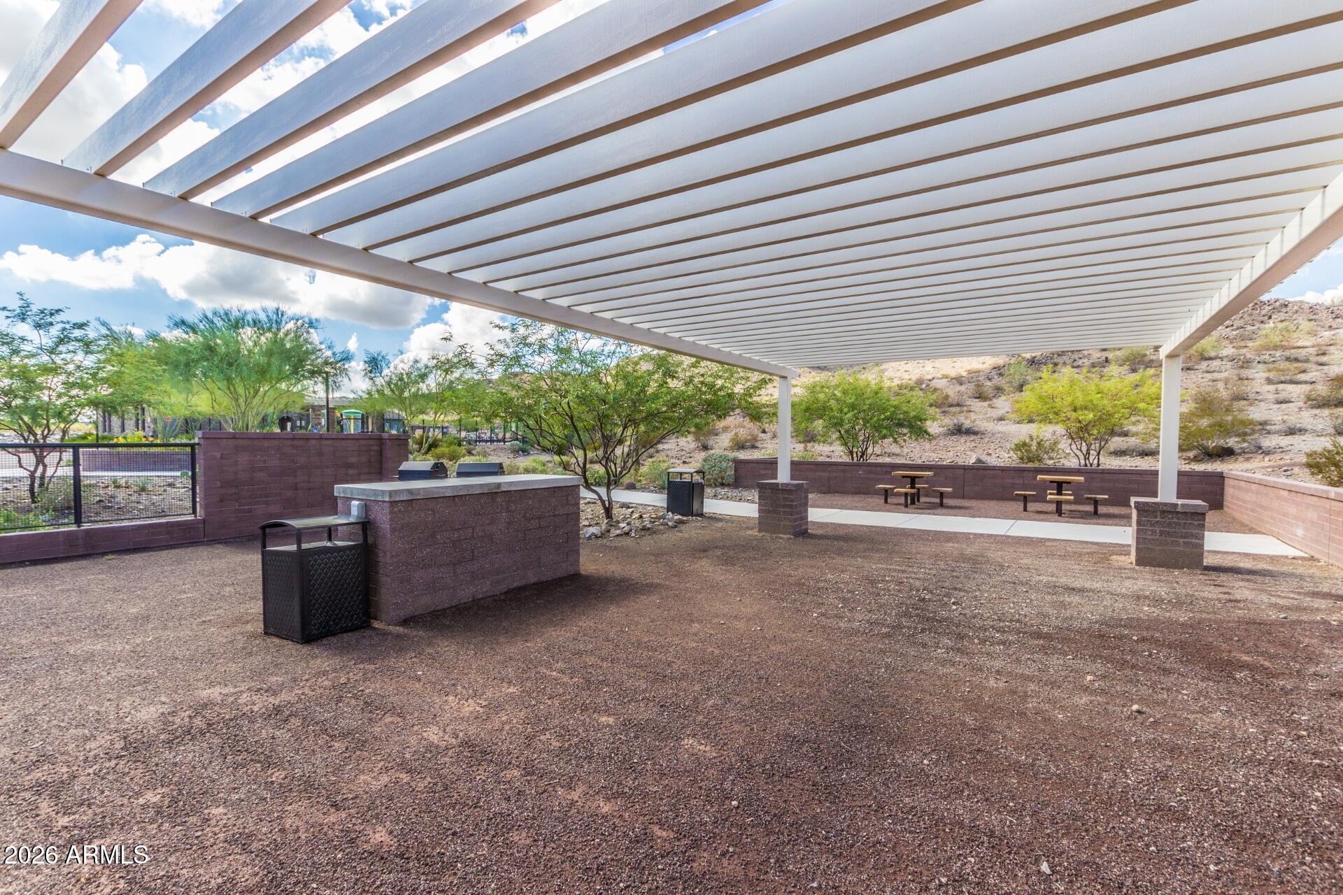 21188 West Almeria Road Buckeye, AZ 85396 - Photo 42 of 43 a view of backyard with outdoor seating