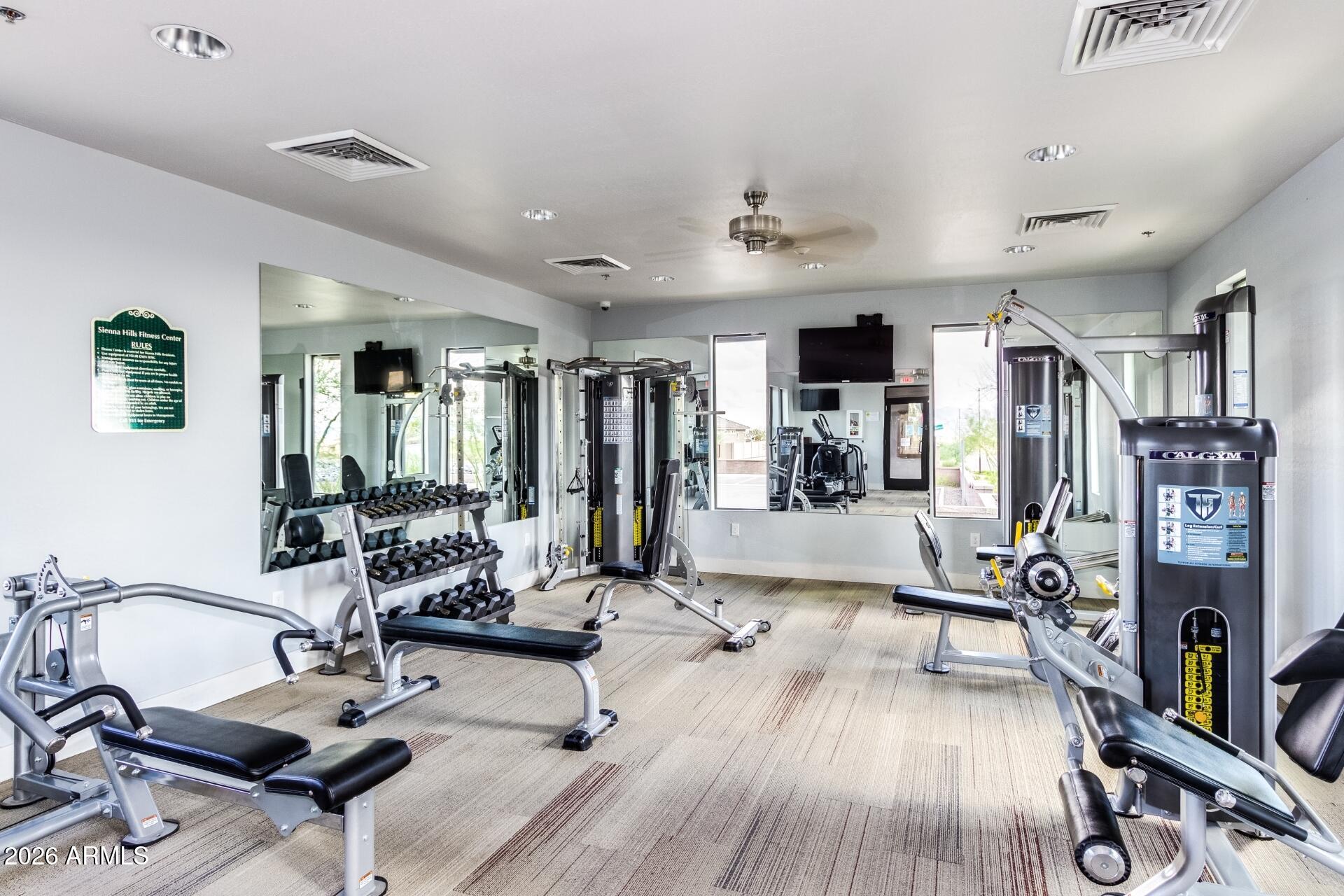 21188 West Almeria Road Buckeye, AZ 85396 - Photo 43 of 43 a view of a room with gym equipment