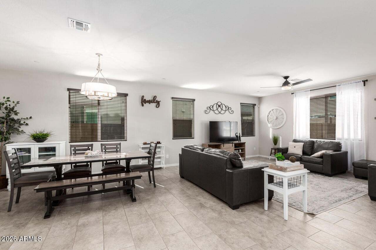 21188 West Almeria Road Buckeye, AZ 85396 - Photo 7 of 43 a living room with furniture and a window
