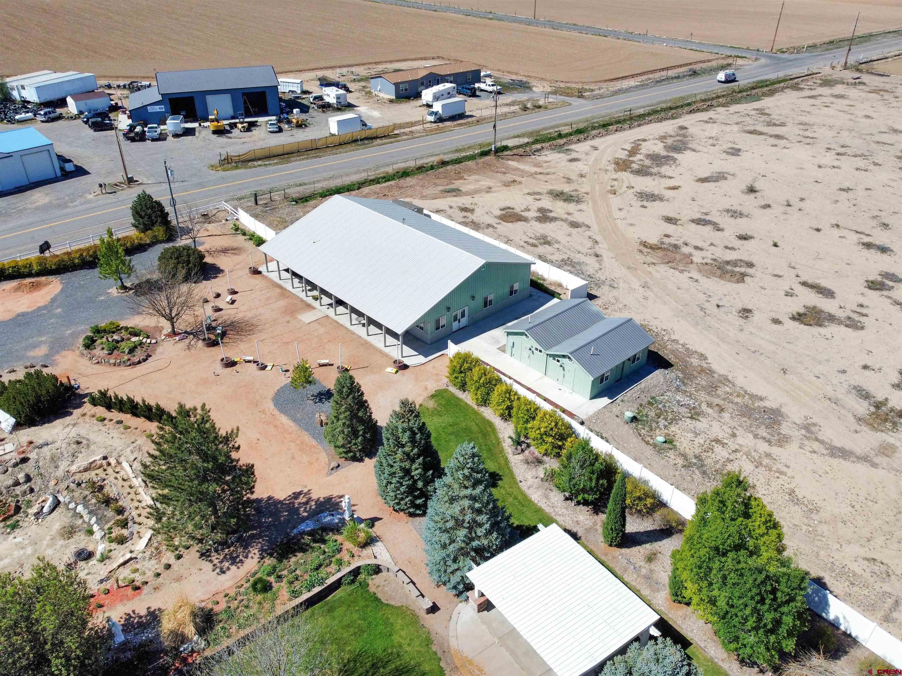 5955 Sawmill Mesa Road Delta, CO 81416 - Photo 21 of 32 an aerial view of a house with a yard