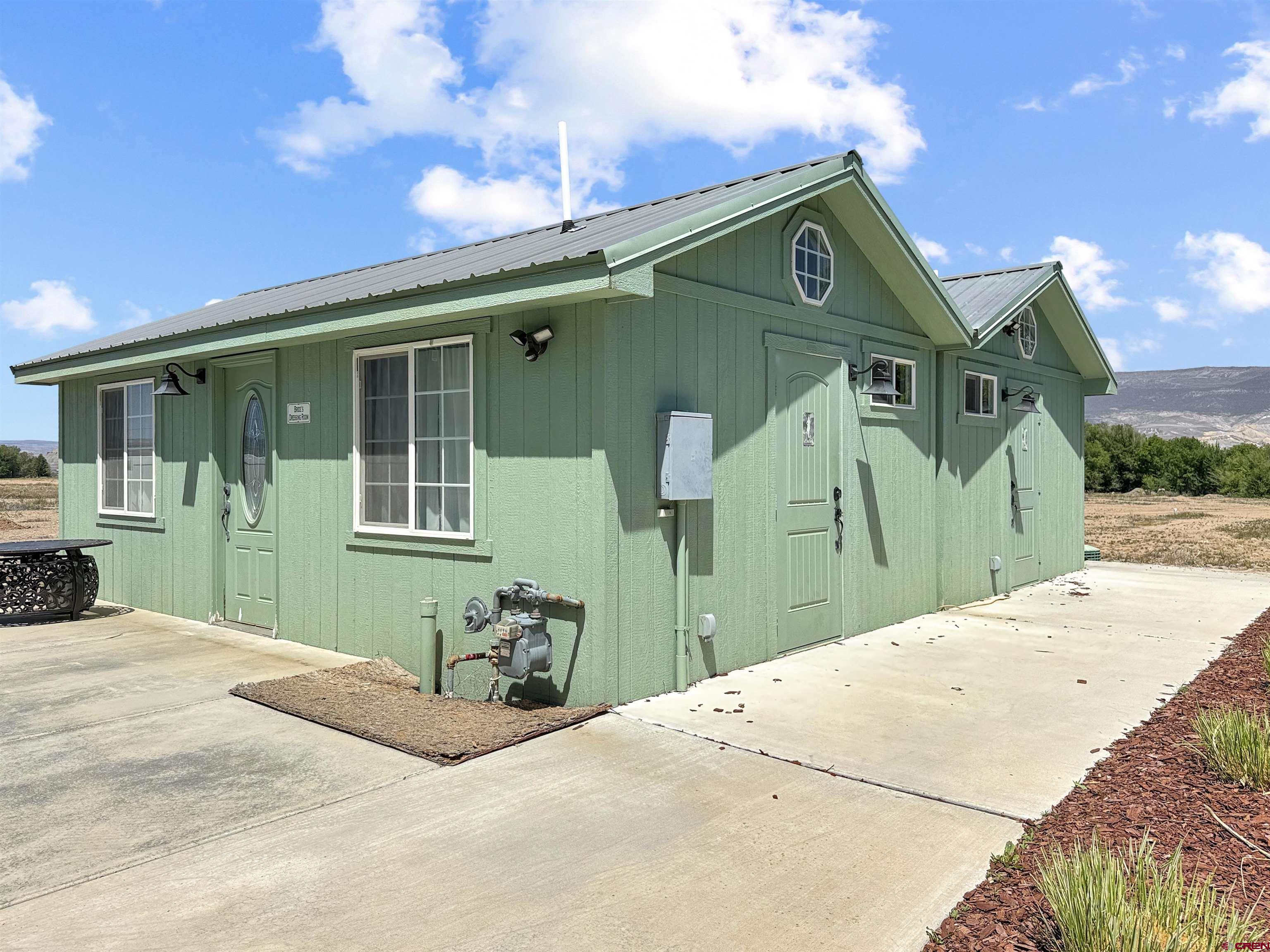 5955 Sawmill Mesa Road Delta, CO 81416 - Photo 26 of 32 a front view of a house with a yard