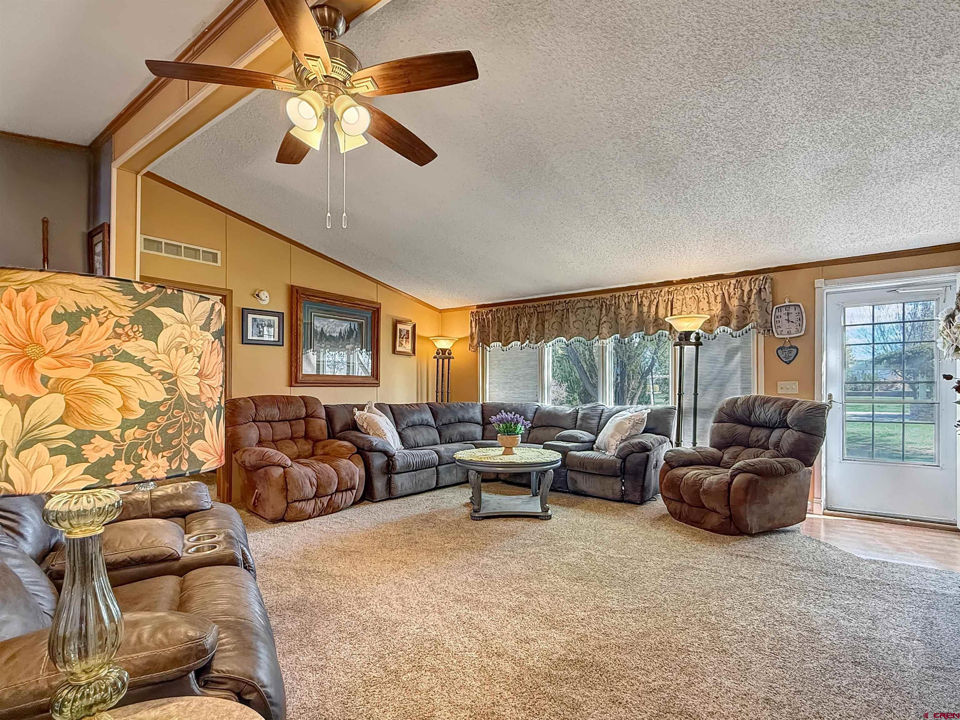 5955 Sawmill Mesa Road Delta, CO 81416 - Photo 8 of 32 a living room with furniture and a large window