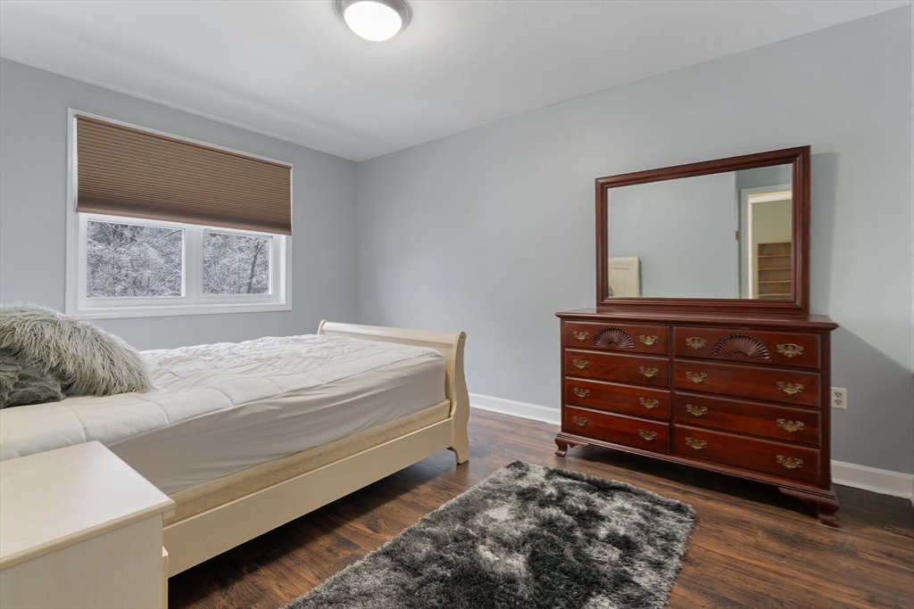 46 Gibbs Street, Unit 4D Worcester, MA 01607 - Photo 13 of 21 a bedroom with a bed and a mirror