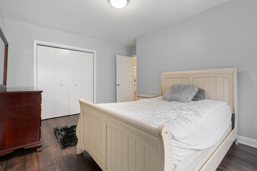 46 Gibbs Street, Unit 4D Worcester, MA 01607 - Photo 14 of 21 a bedroom with a bed and a dresser