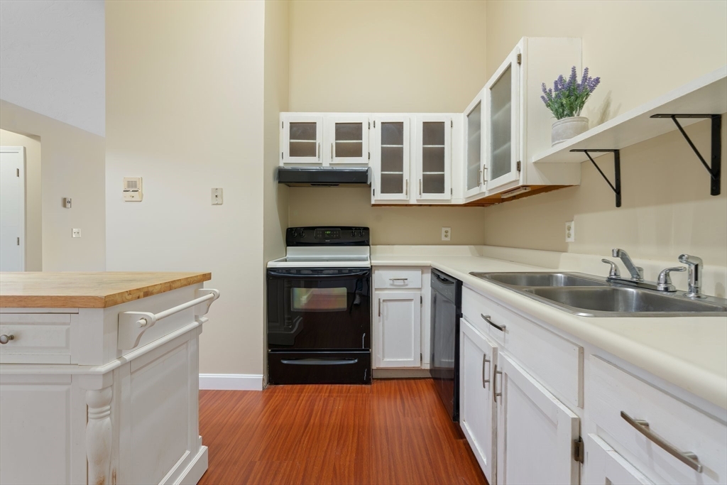 46 Gibbs Street, Unit 4D Worcester, MA 01607 - Photo 4 of 21 a kitchen with stainless steel appliances granite countertop a stove and a sink