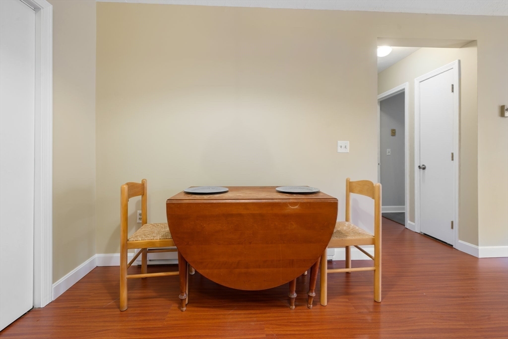 46 Gibbs Street, Unit 4D Worcester, MA 01607 - Photo 7 of 21 a view of a dining room with furniture and wooden floor