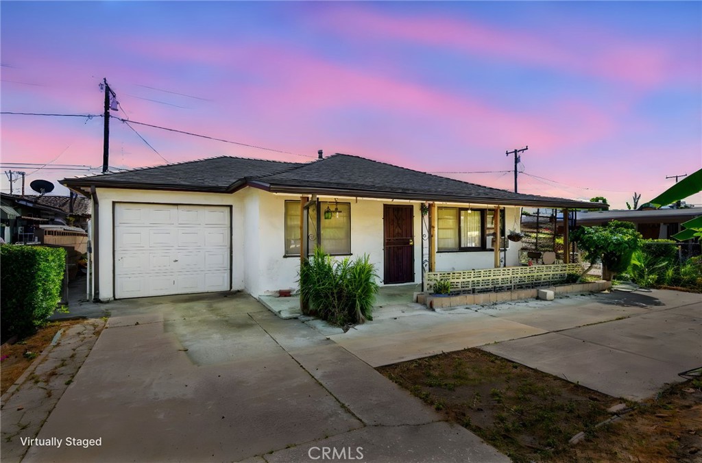 12128 161st Street Norwalk, CA 90650 - Photo 1 of 18 a front view of a house with yard