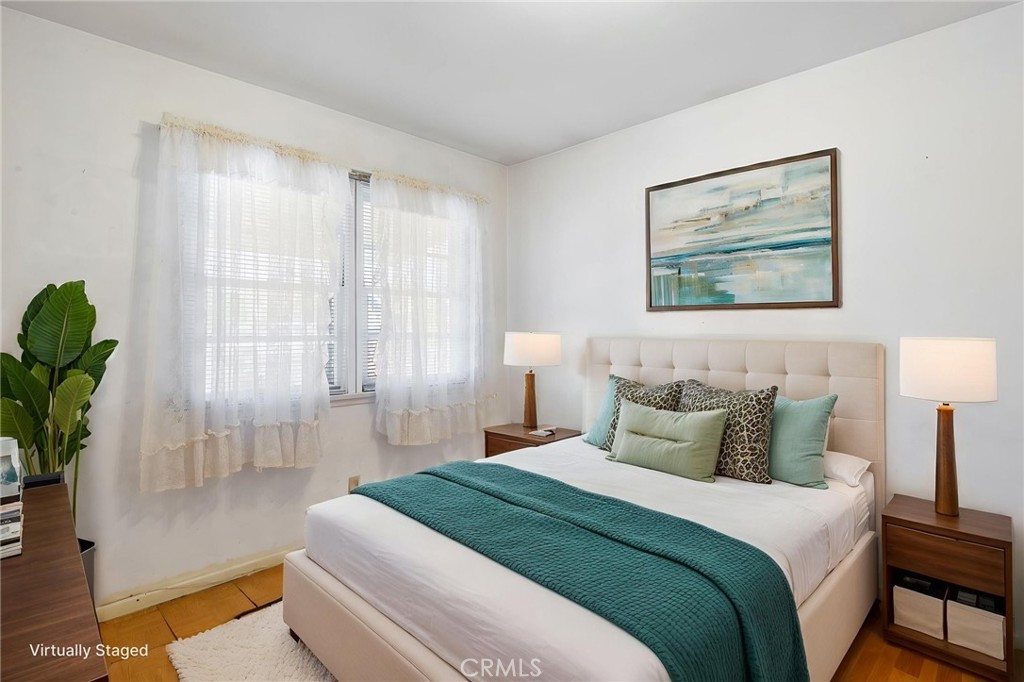 12128 161st Street Norwalk, CA 90650 - Photo 12 of 18 a bedroom with bed and window