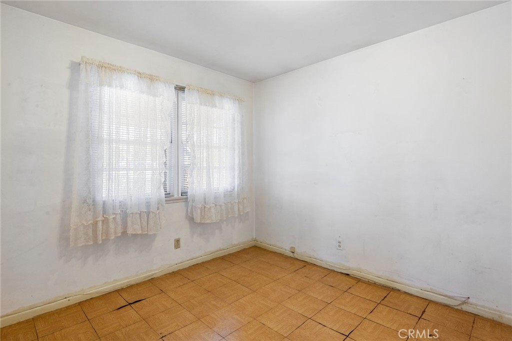 12128 161st Street Norwalk, CA 90650 - Photo 13 of 18 a view of an empty room with a window