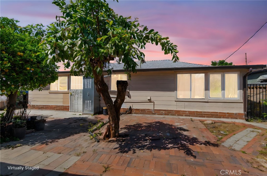 12128 161st Street Norwalk, CA 90650 - Photo 16 of 18 a front view of a house with a yard