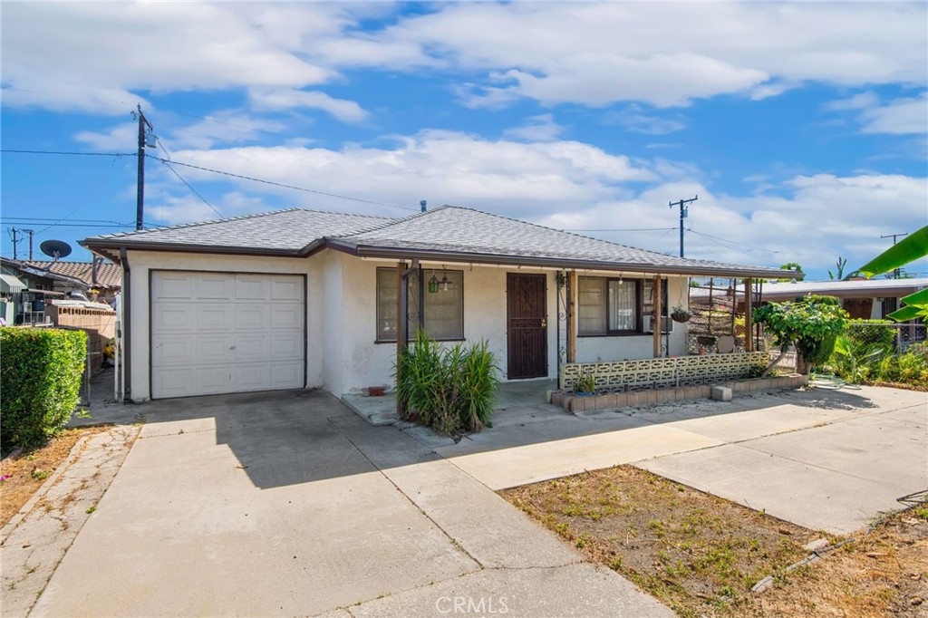 12128 161st Street Norwalk, CA 90650 - Photo 2 of 18 front view of a house with a yard