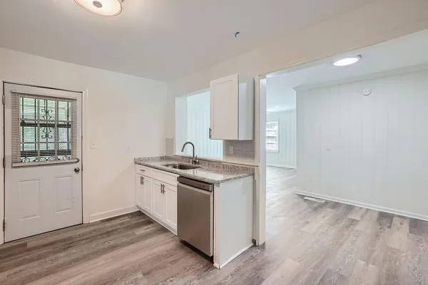 a kitchen with a stove and a sink
