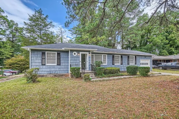 a front view of a house with a yard