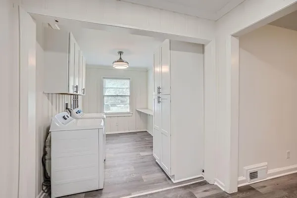 a room with a sink and mirror