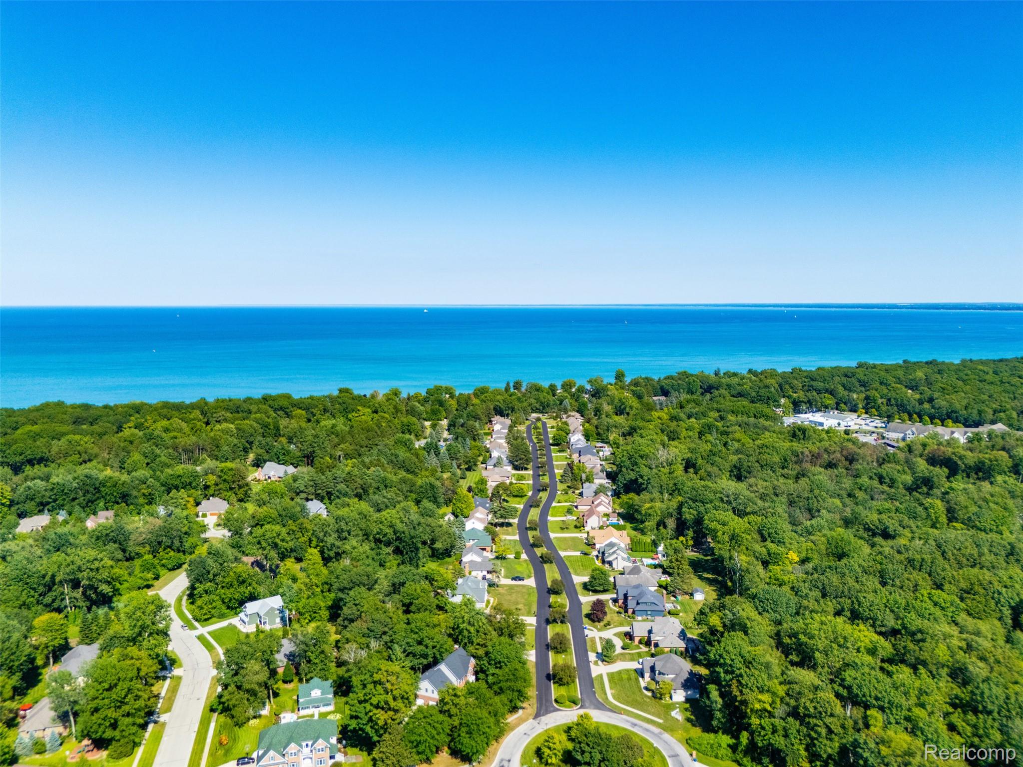 5161 Parker Road Fort Gratiot, MI 48059 - Photo 62 of 64 Aerial perspective showcasing a residential community with mature trees and paved roads