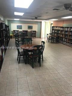 17021 North Bay Road, Unit 329 Sunny Isles Beach, FL 33160 - Photo 1 of 18 a dining space with furniture and window