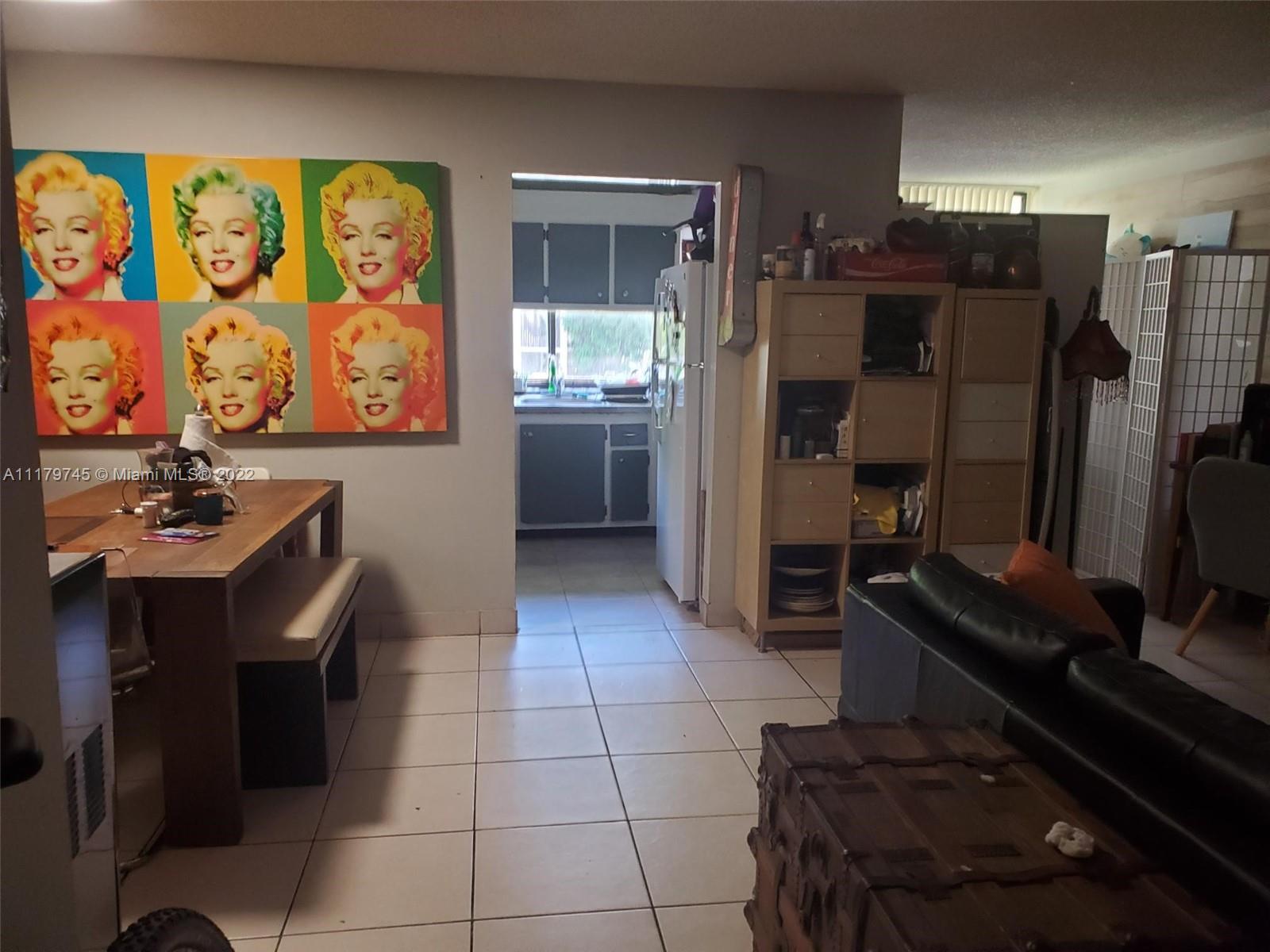 17021 North Bay Road, Unit 329 Sunny Isles Beach, FL 33160 - Photo 12 of 18 a kitchen with a sink cabinets and appliances