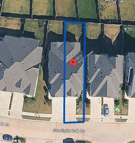 an aerial view of houses with street