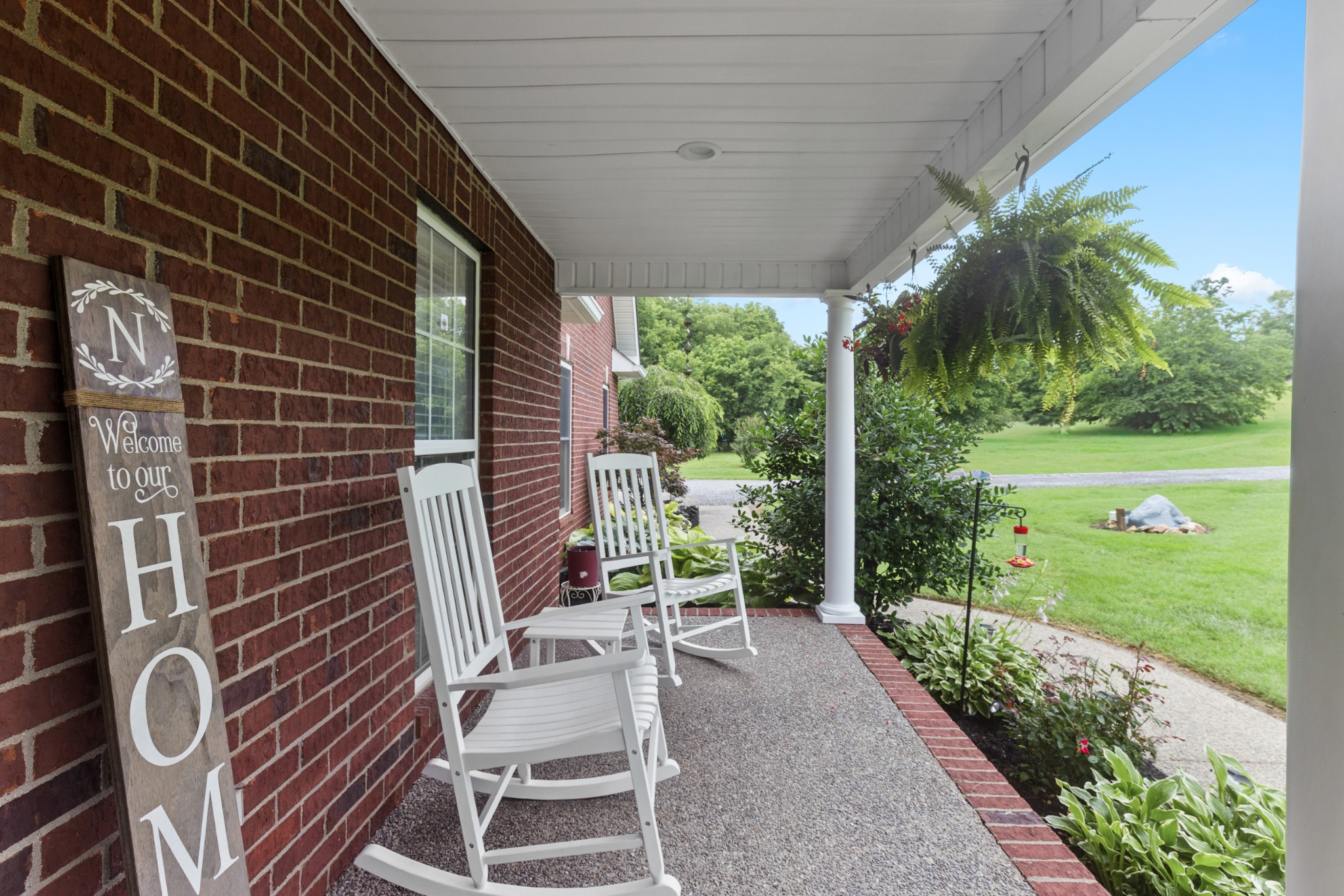 454 Campbell Hollow Road Bethpage, TN 37022 - Photo 9 of 57 a view of a patio with table and chairs and potted plants with wooden floor