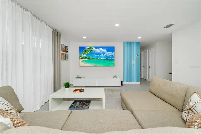 a living room with furniture and a lamp