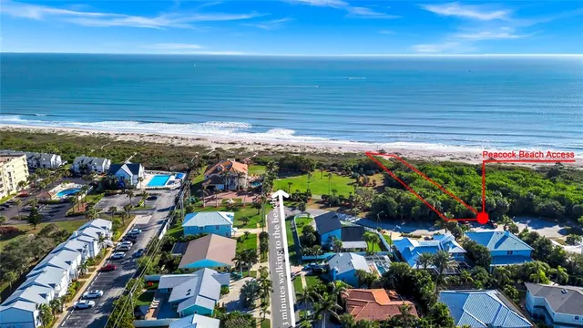 a view of a dining room with furniture and a potted plant