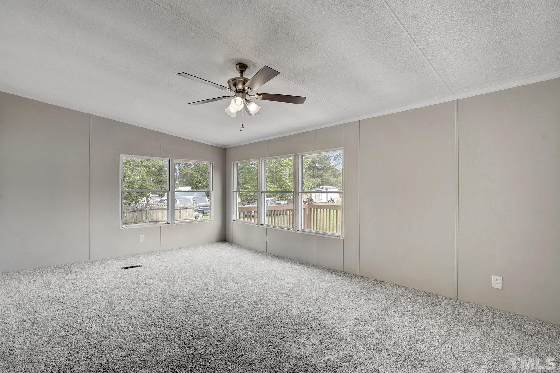 105 Rains Crossroads Road Selma, NC 27576 - Photo 12 of 30 a view of an empty room with a window