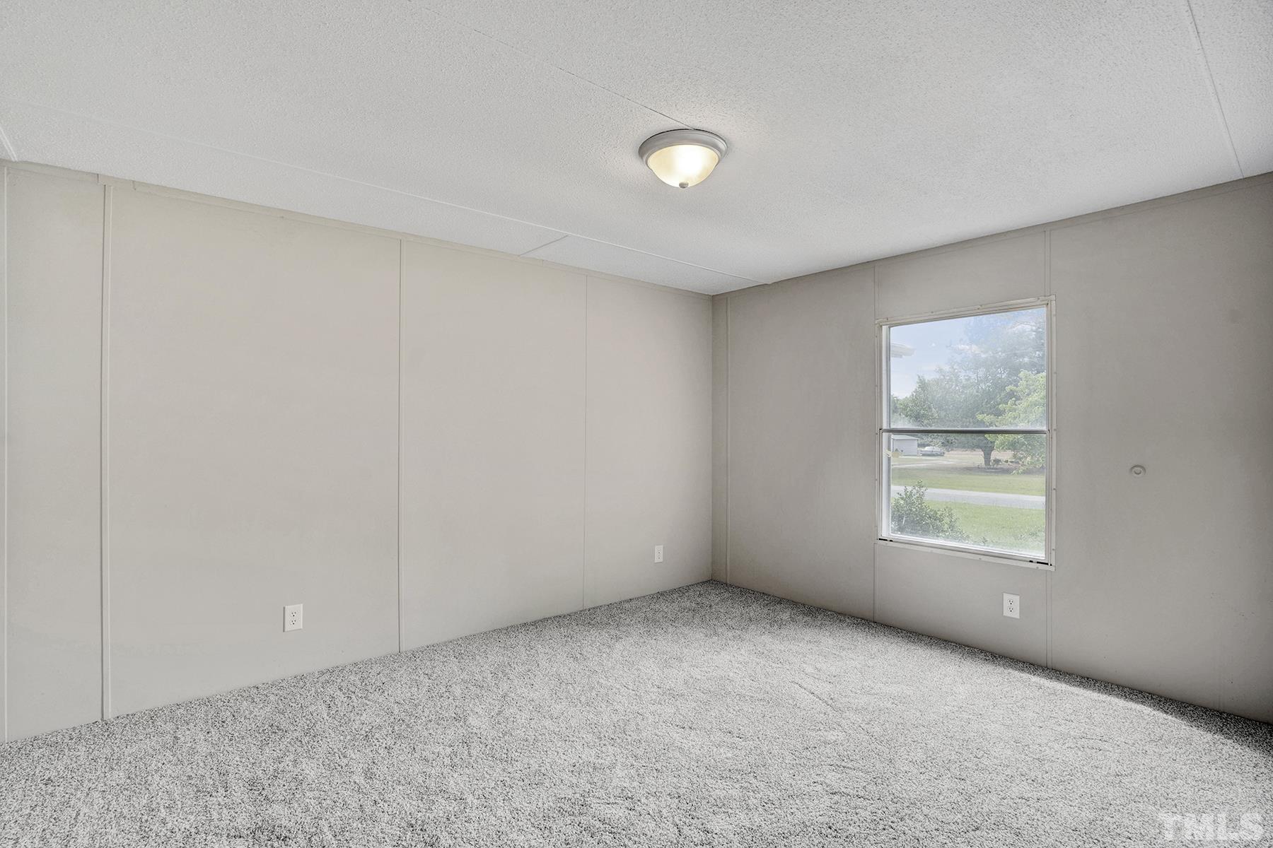 105 Rains Crossroads Road Selma, NC 27576 - Photo 15 of 30 a view of an empty room with a window