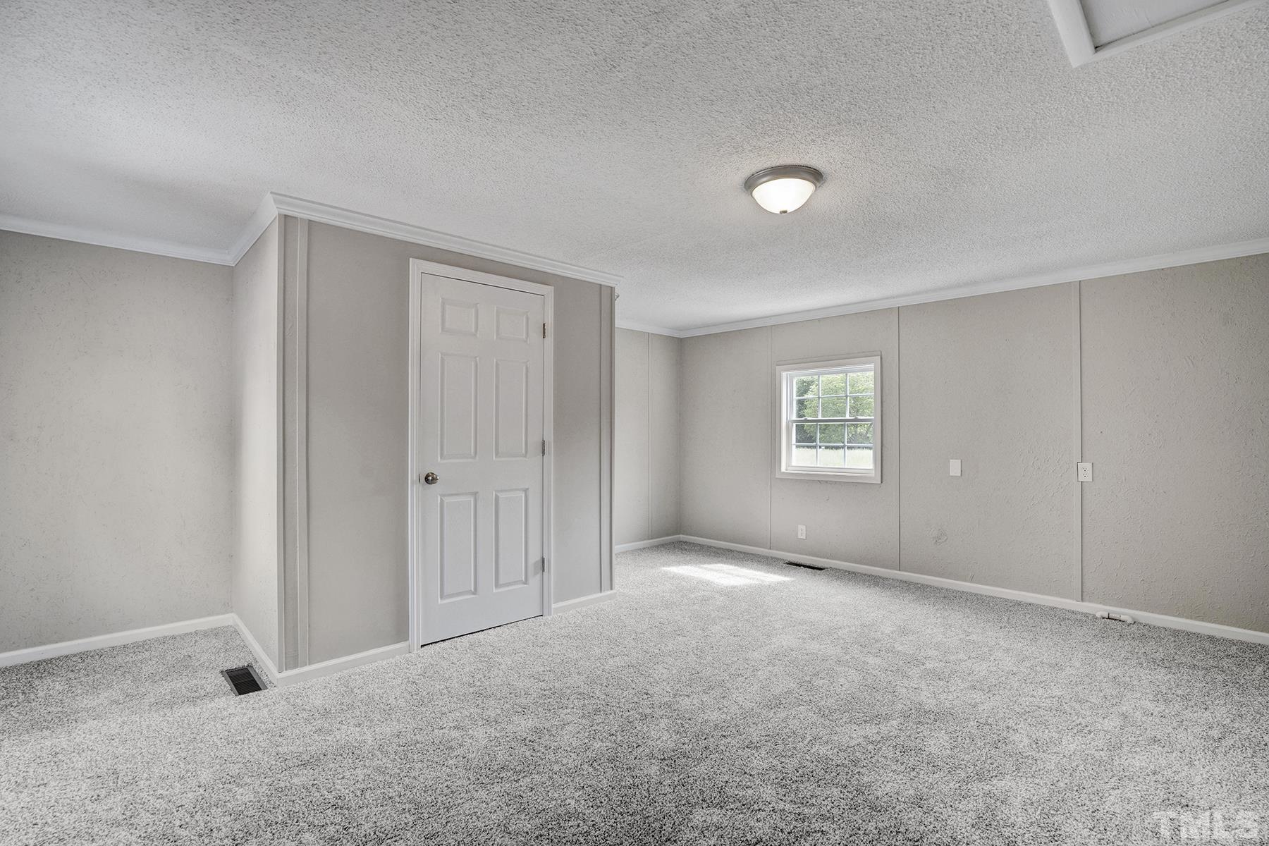 105 Rains Crossroads Road Selma, NC 27576 - Photo 17 of 30 a view of an empty room with a window