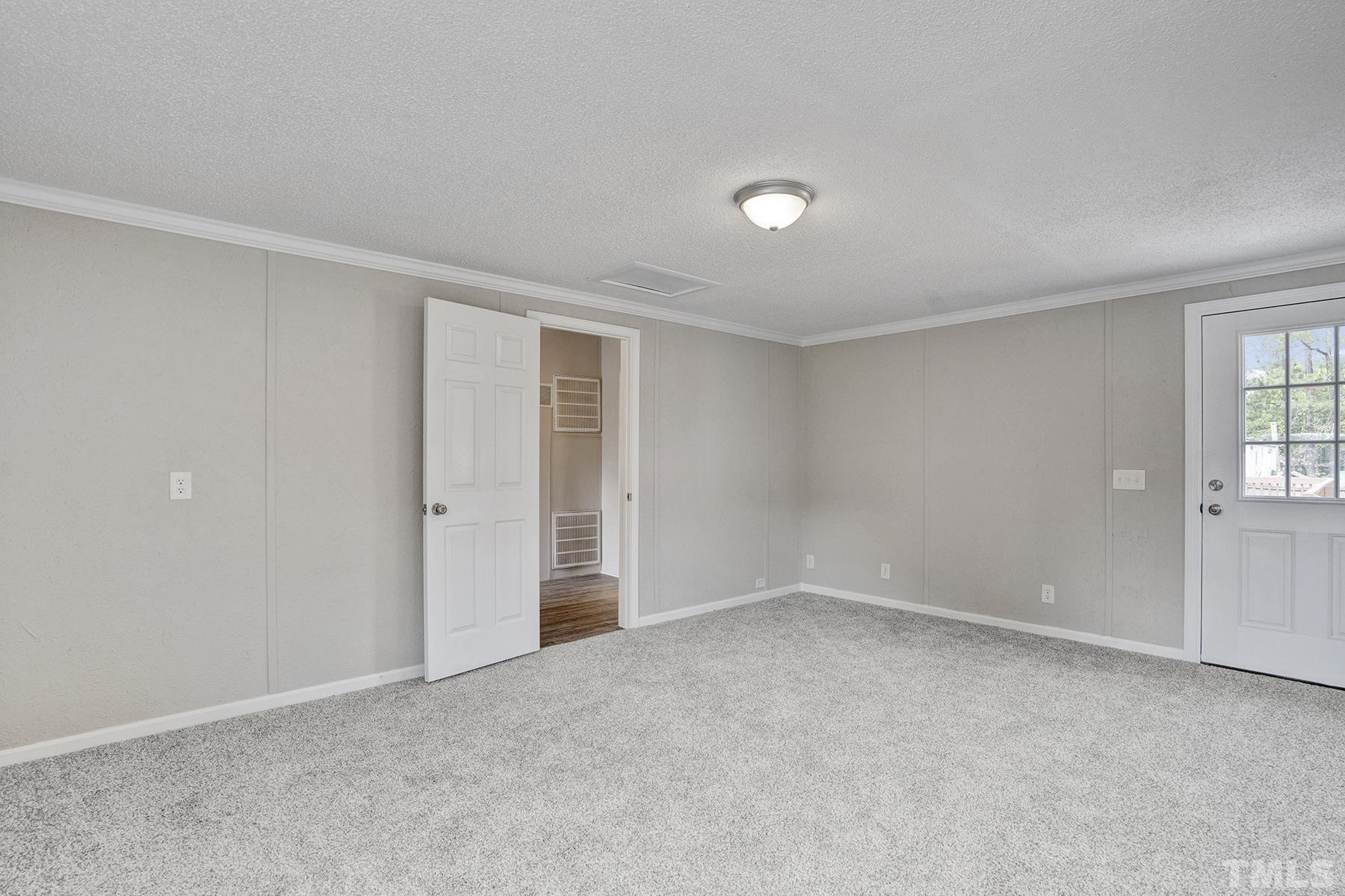105 Rains Crossroads Road Selma, NC 27576 - Photo 18 of 30 a view of an empty room with a window