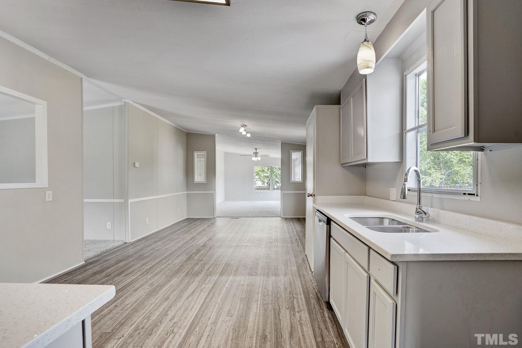 105 Rains Crossroads Road Selma, NC 27576 - Photo 23 of 30 a kitchen with a sink stove and cabinets
