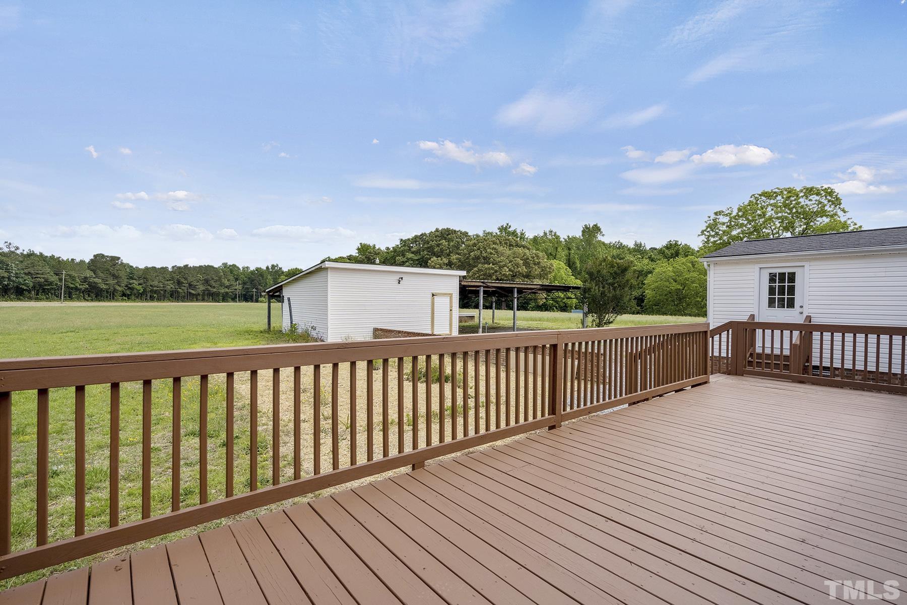 105 Rains Crossroads Road Selma, NC 27576 - Photo 24 of 30 a view of a wooden roof deck