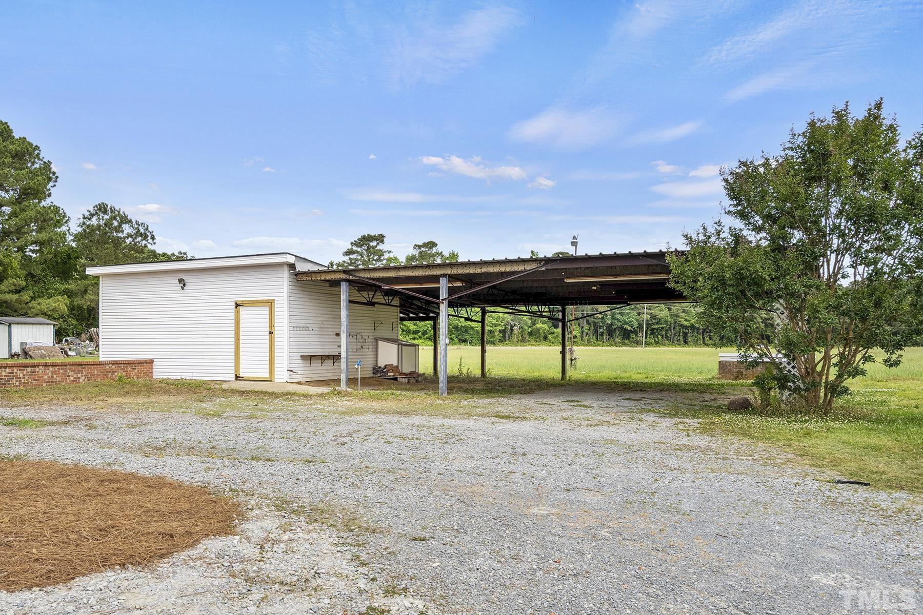 105 Rains Crossroads Road Selma, NC 27576 - Photo 26 of 30 a view of a house with a yard and tree s