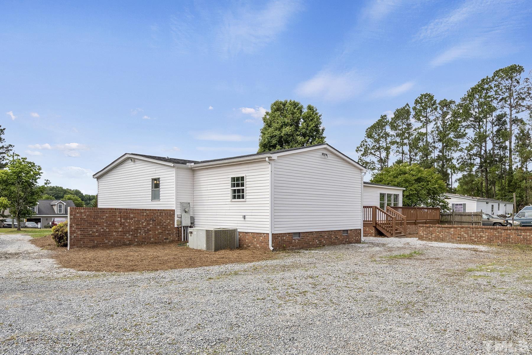 105 Rains Crossroads Road Selma, NC 27576 - Photo 28 of 30 a view of a house with a backyard