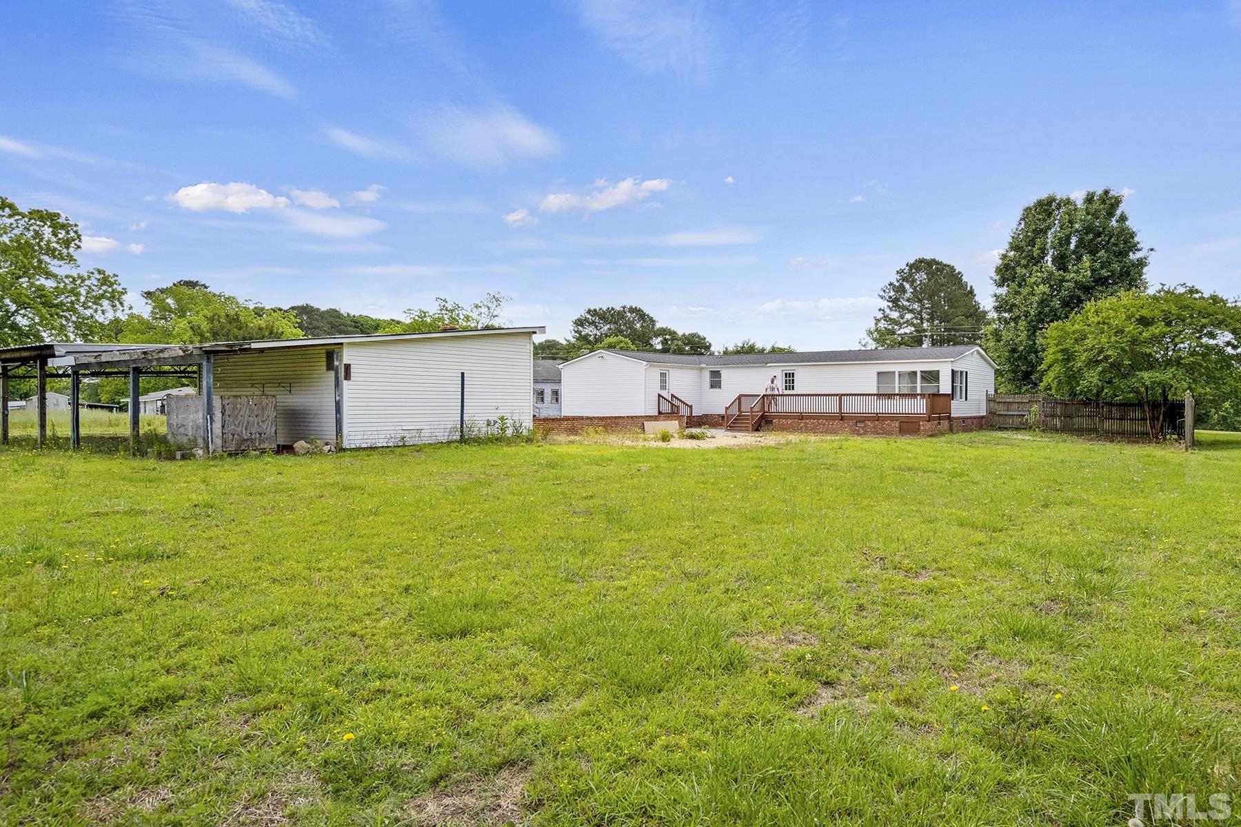 105 Rains Crossroads Road Selma, NC 27576 - Photo 30 of 30 a view of a house with a yard