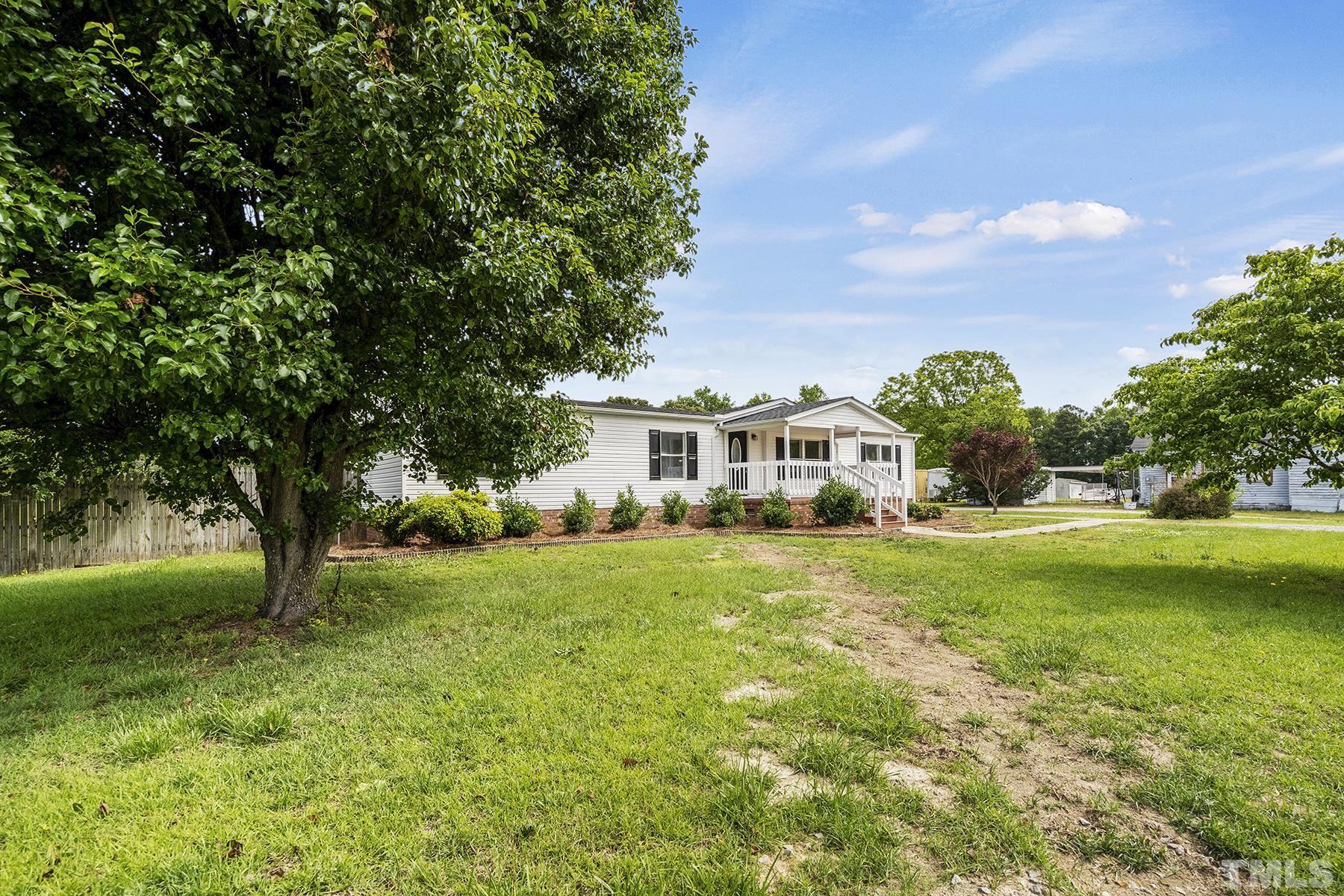 105 Rains Crossroads Road Selma, NC 27576 - Photo 3 of 30 a front view of a house with a yard