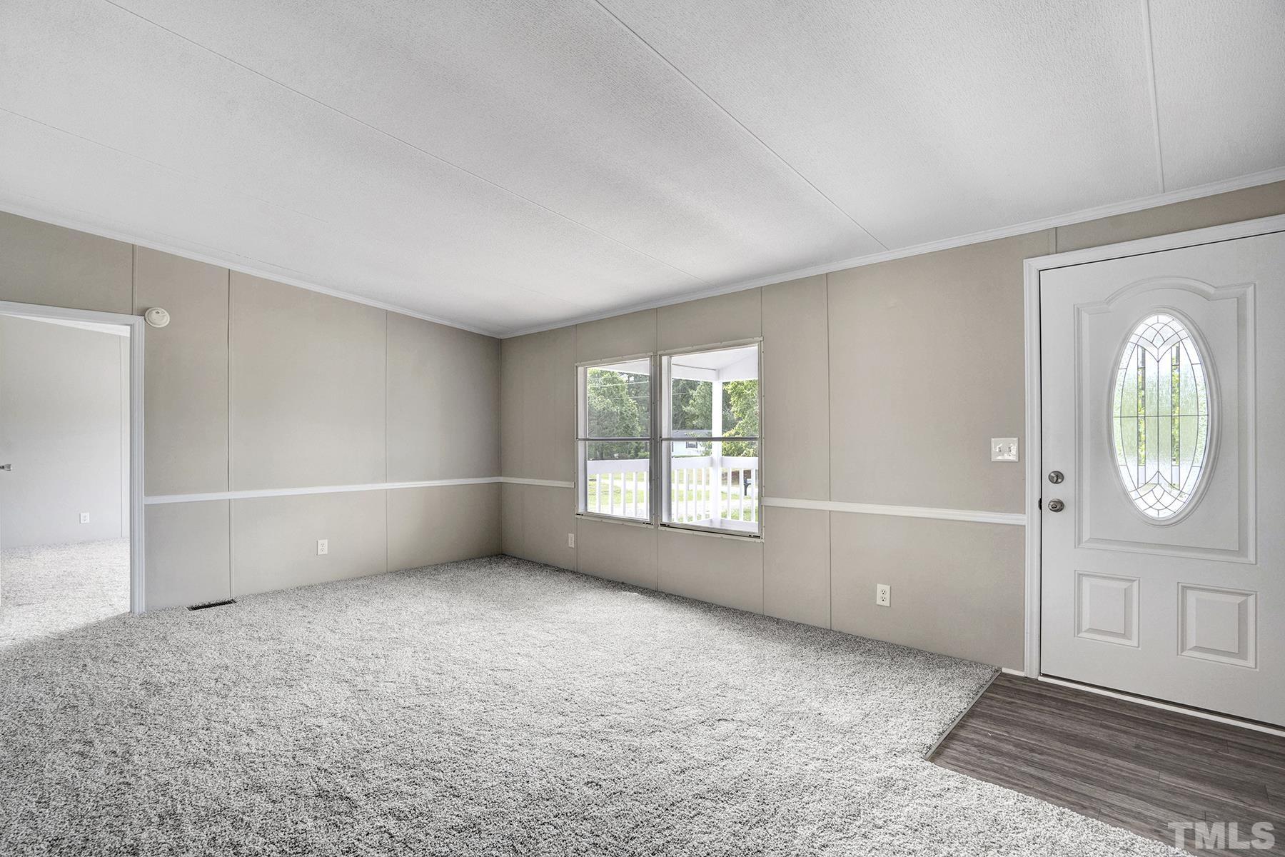 105 Rains Crossroads Road Selma, NC 27576 - Photo 7 of 30 an empty room with windows