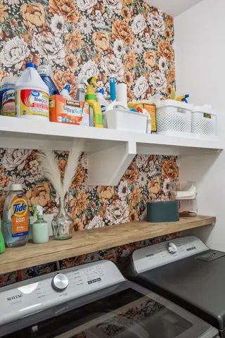 a bathroom with a double vanity sink and mirror