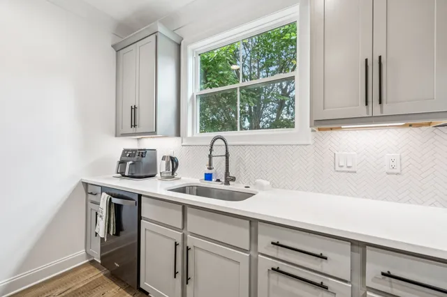 a room with furniture and a flat screen tv